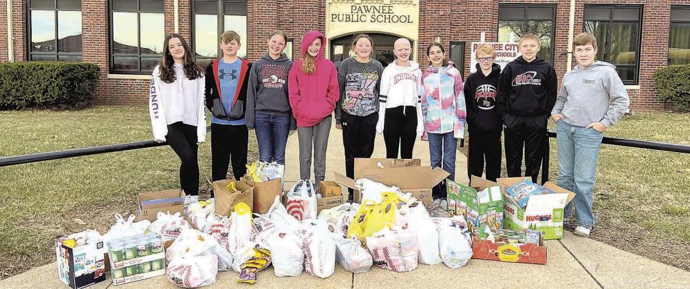 The Pawnee City Middle School Leadership Team collected over 600 items for donation to the SENCA food pantry. Pictured L to R: Ava Schlund, Isaac Rottinghaus, Ainsley Rauner, Aubrey Sisco, Amelia Strathman, Emma Turnbull, Sophia Sunneberg, Zeke Ferebee, Ryan Plager and Lane Johnson.